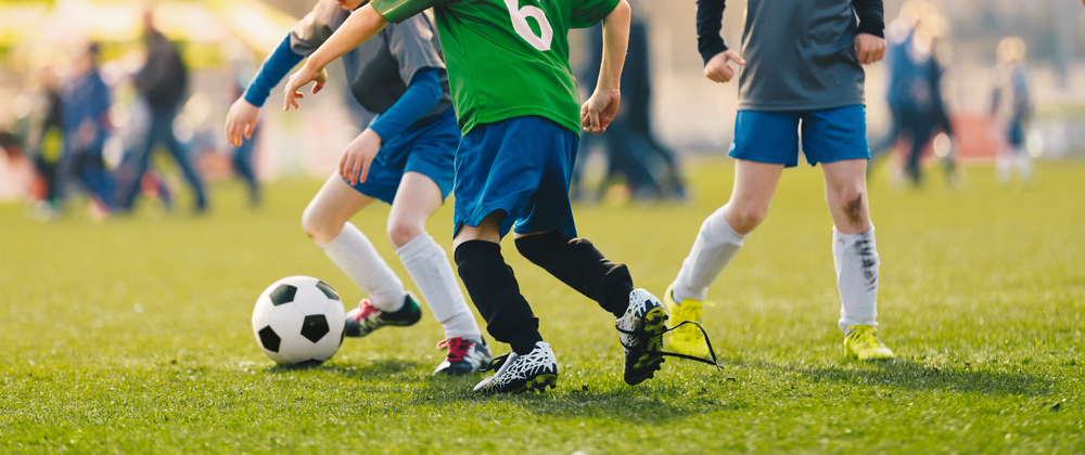 Kids playing football